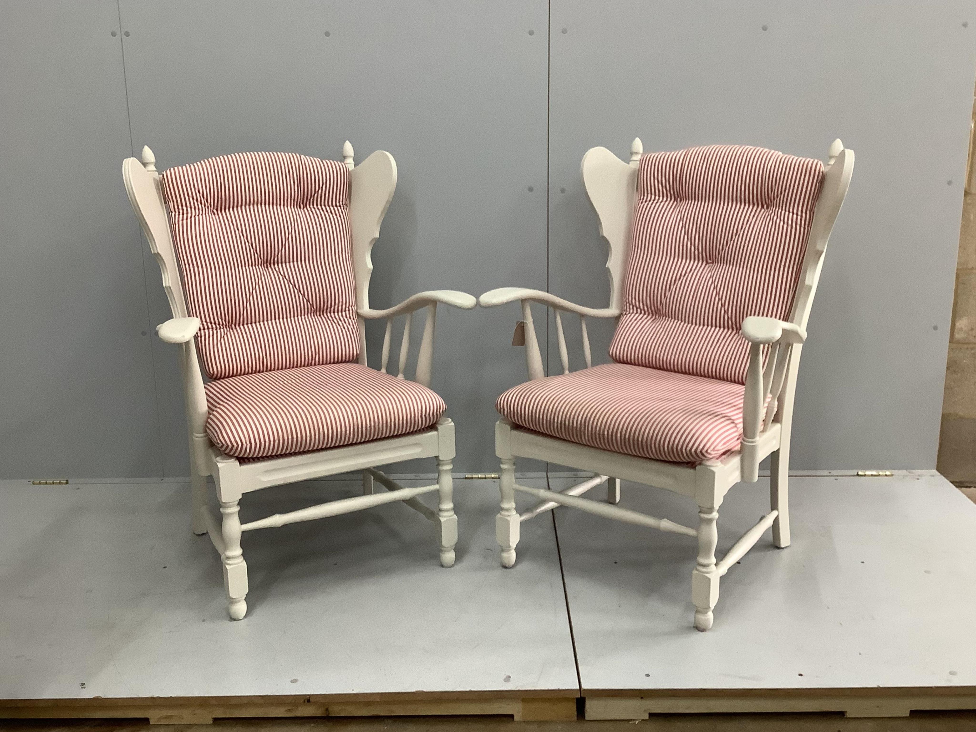 A pair of 20th century Swedish painted armchairs, width 71cm, depth 62cm, height 104cm. Condition - good